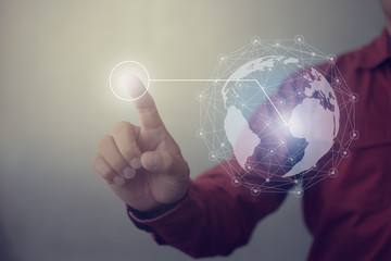 Poster - Businessman hand touching virtual button on Earth map point with network connection, international meaning
