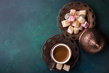 Traditional Turkish Coffee  And Turkish Delight On Dark Green Wooden Background. Flat Lay