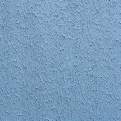 Rough stucco textured background of a wall with natural light. Abstract texture of plaster.