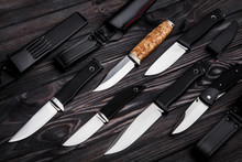 Knives On A Wooden Background