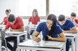 © LStockStudio - Students Taking an Exam