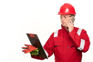 Portrait of architect wear red safety helmet and workwear uniform