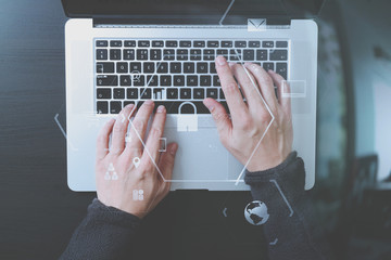 Poster - cyber security internet and networking concept.Businessman hand working with VR screen padlock icon on laptop computer background
