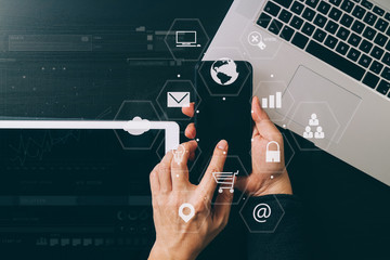Poster - cyber security internet and networking concept.Businessman hand working with VR screen padlock icon mobile phone on computer background
