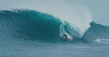 Surfer Rides Giant Blue Ocean Wave. Shot On RED In 4k. Big Wave Surfing. Slow Motion