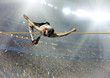 © Andrii IURLOV - Athlete in action of high jump.