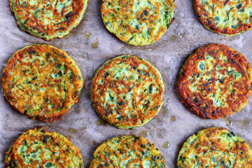 Wall Mural - tasty  zucchini fritters on baking paper