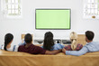 © Monkey Business - Rear View Of Group Of Young Friends Watching Television Together