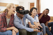 © Monkey Business - Friends Playing Computer Game With Virtual Reality Headset