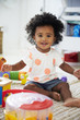 © Monkey Business - Portrait Of Baby Girl Having Fun In Playroom With Toys