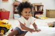 © Monkey Business - Happy Baby Girl Playing With Toys In Playroom