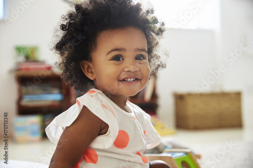 Fotomural Happy Baby Girl Playing With Toys In Playroom