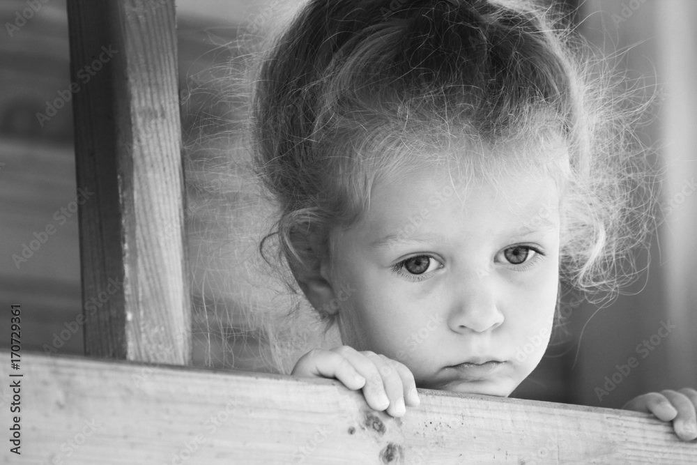 Little sad girl on the playground. Black and white series. Stock Photo ...