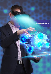 Wall Mural - Business, Technology, Internet and network concept. Young businessman working in virtual reality glasses sees the inscription: Compliance