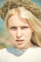 Wall Mural - Girl with wreath on blond hair outdoors