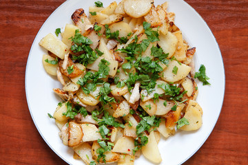 Wall Mural - Fried potatoes with bacon and parsley VIII