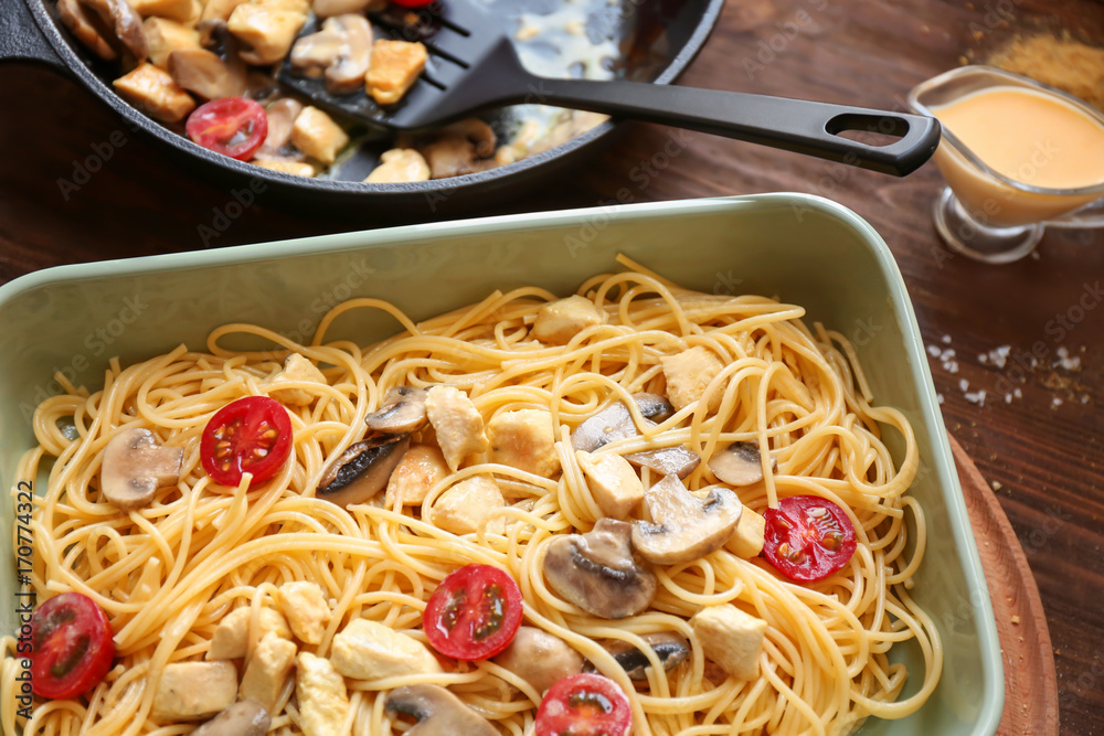 Delicious roasted turkey tetrazzini in baking dish on table
