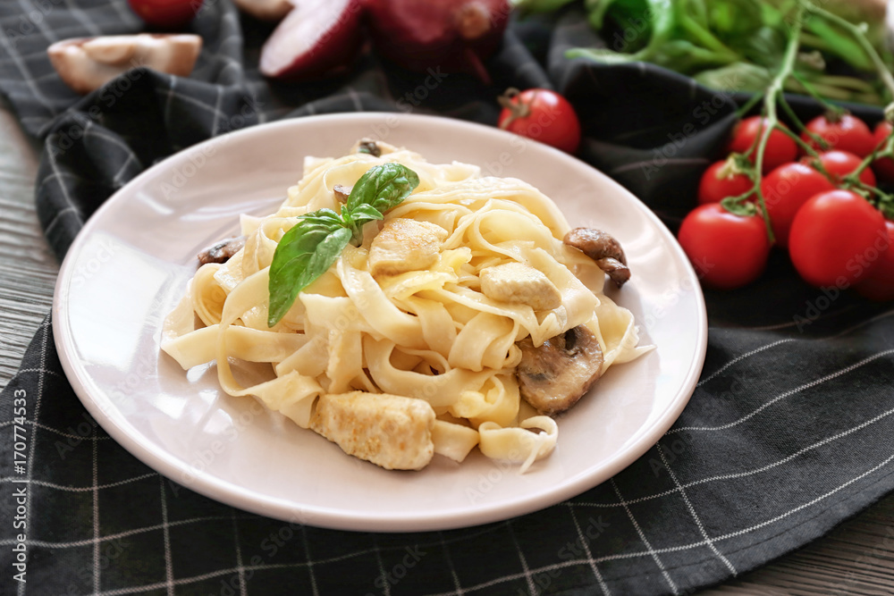 Plate with delicious turkey tetrazzini on table