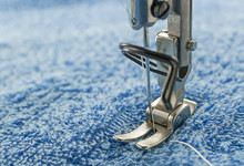 Macro Close Of Sewing Machine Head Parts Needle Holder And Presser Foot Holder On Towel Fabric