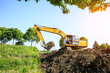 Wall Mural - Excavator working at construction site