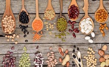 Assortment Of Legumes Beans (Mung Bean, Soya Bean, Red Kidney Bean, Navy Bean, Peanut) In Wooden Spoon On Wooden Background, Top View. 