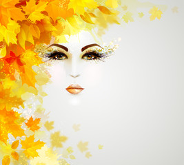 Fotomurales - Beautiful woman face is in autumn circle of yellow and orange leaves on the light background.