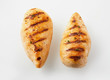 Two grilled chicken breasts with white copy space