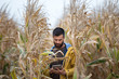 © Budimir Jevtic - Farmer with tablet in corn field
