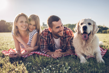 Wall Mural - Happy family with dog