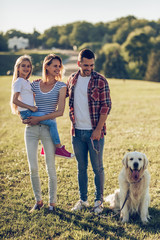 Wall Mural - Happy family with dog