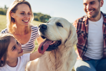 Wall Mural - Happy family with dog