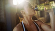 Strong Athletic Woman Drinks From a Water Bottle After Exhausting Cross Fitness Bodybuilding Training at Her Favourite Gym.
