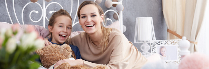 Smiling woman and daughter