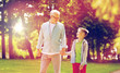 © Syda Productions - grandfather and grandson walking at summer park