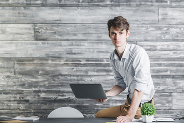 Poster - Handsome businessman using laptop computer