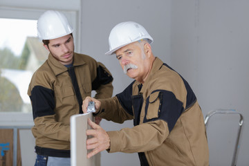 young male architect and construction worker