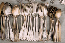 Top View Of Set Retro, Old, Vintage Cutlery Spoons And Forks On 