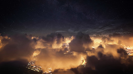 Wall Mural - flying over the deep night clouds with dark sky. flight through moving cloudscape over night city li