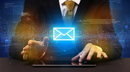 Businessman typing and mailing icon above