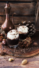 Wall Mural - hot chocolate in glass cups and cream with nuts