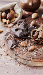 Wall Mural - pieces of chocolate with nuts and cinnamon