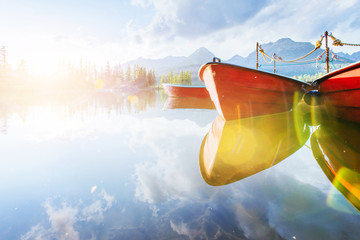 Wall Mural - Boat on the dock surrounded mountains. Fantastic Shtrbske Pleso High Tatras. Slovakia