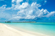 Beautiful tropical landscape - sandy beach and wooden villas over  Indian ocean, Maldives island