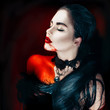 © Subbotina Anna - Beauty Halloween sexy vampire woman with dripping blood on her mouth
