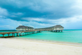 Fototapeta Morze - Wooden villas over water of the Indian Ocean, Maldives