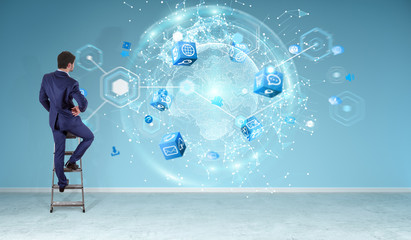 Poster - Businessman using digital planet earth interface on a wall 3D rendering