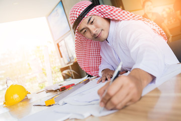 Wall Mural - business arabian man working with paper and document on wooden table business concept