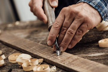 Wall Mural - Carpenter carving wood