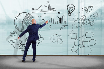 Poster - businessman in front of a wall writing on a business reminder interface application - technology con