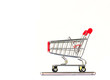 © kurapy - shopping cart on smartphone on white background